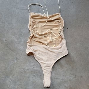 light tan string backless mesh leotard